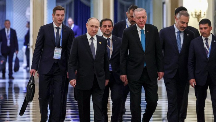 1756748174441-momen-hangat-putinerdogan-jabat-tangan-di-ktt-sco-tianjin-1756719436396_169