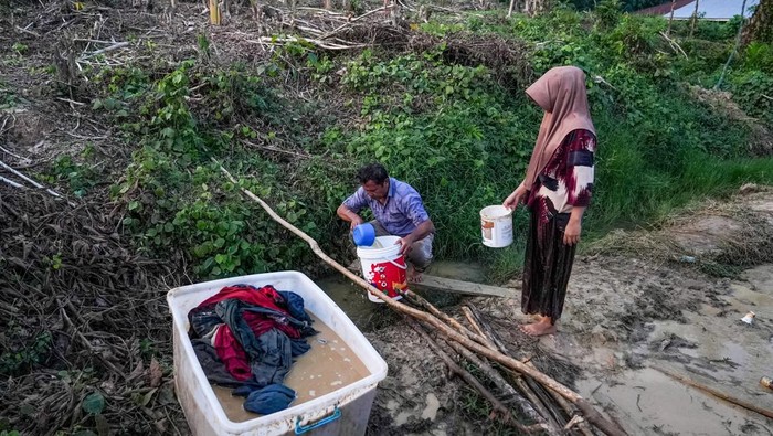 1765019146945-korban-banjir-aceh-tamiang-terpaksa-hidup-dengan-air-parit-1765012485341_169