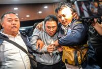 1765904746502-youtuber-muhammad-adimas-diperiksa-polda-jabar-usai-ditangkap-di-semarang-1765854541811_169